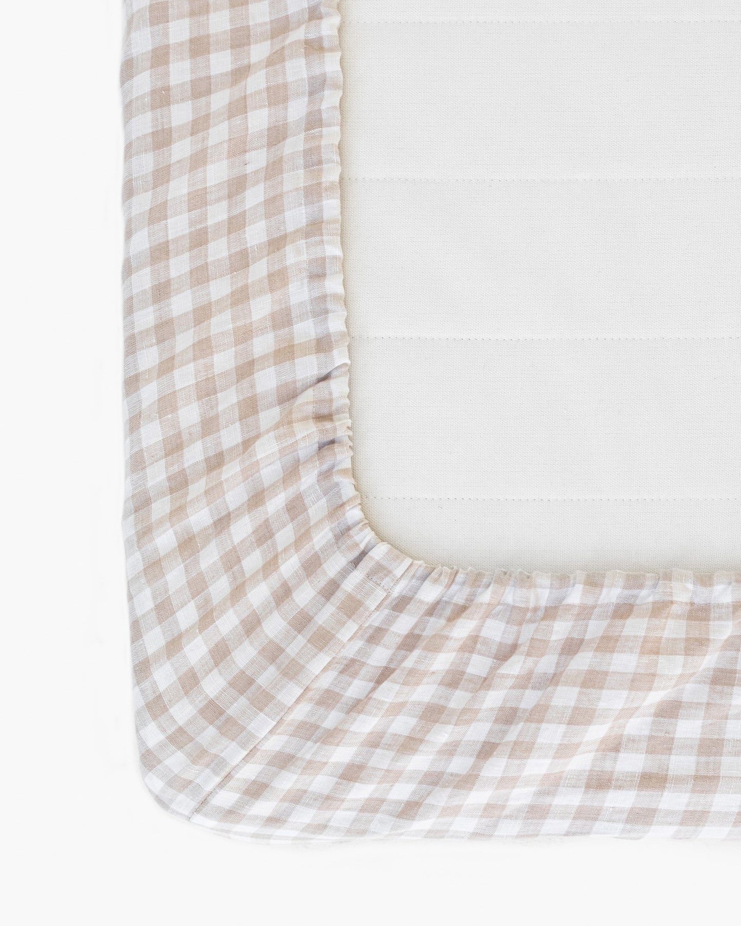 https://cdn.shopify.com/s/files/1/0640/8454/1699/files/natural-gingham-fitted-sheet-2.jpg?v=1697009059