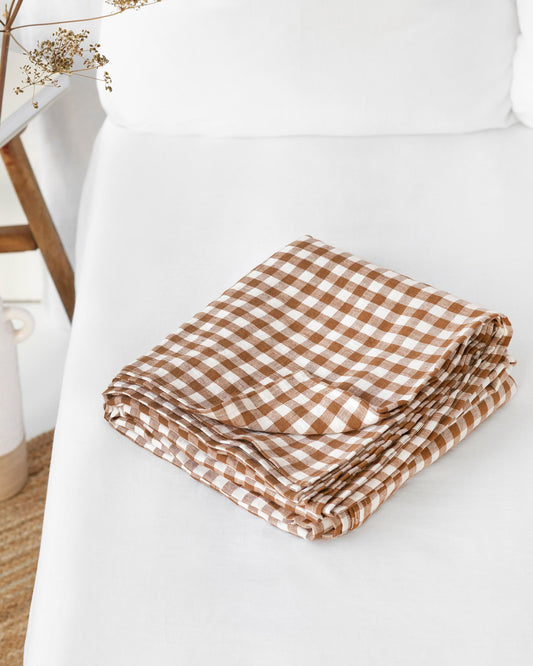https://cdn.shopify.com/s/files/1/0640/8454/1699/files/cinnamon-gingham-flat-sheet.jpg?v=1698136749