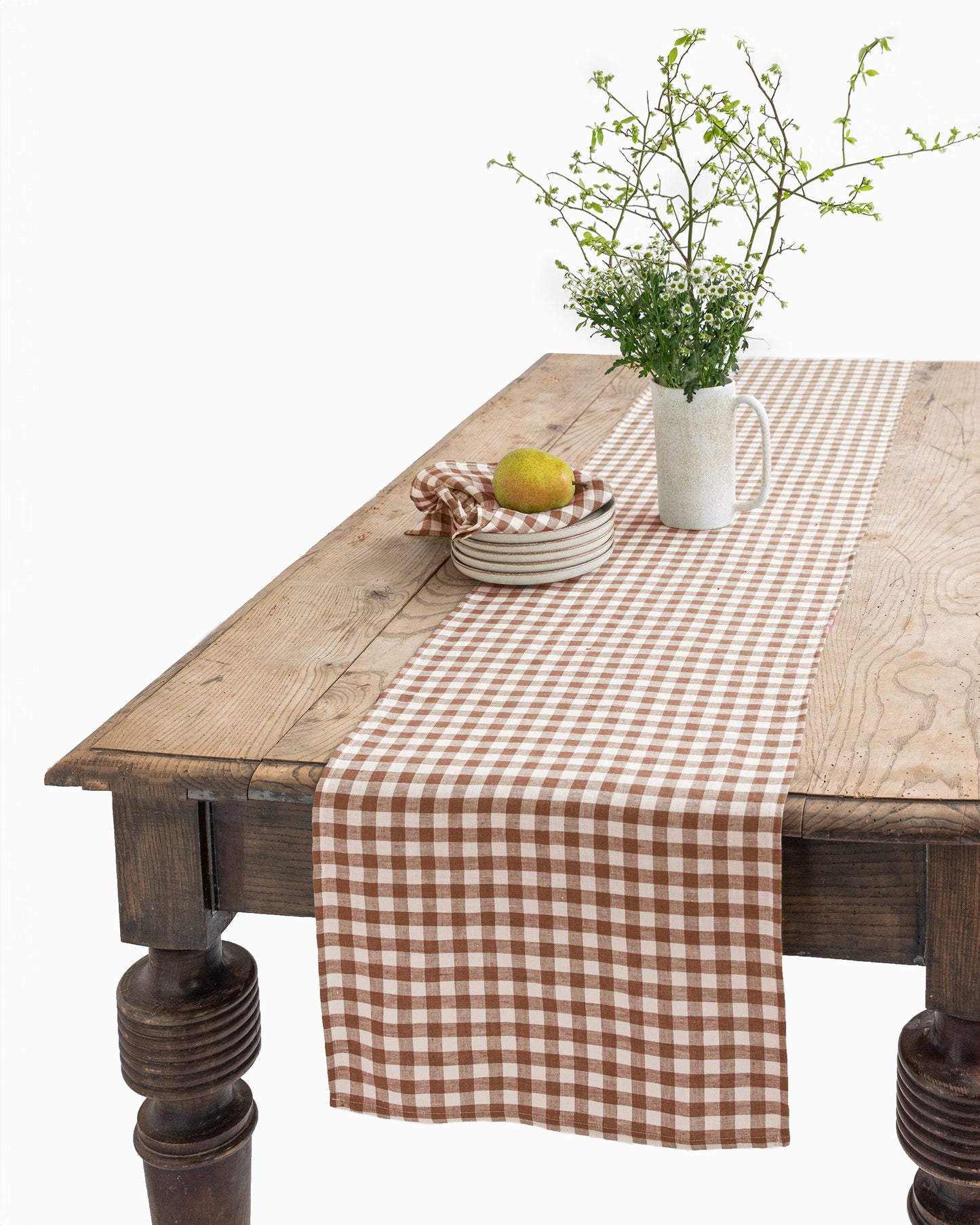 https://cdn.shopify.com/s/files/1/0640/8454/1699/files/linen-table-runner-cinnamon-gingham-1.jpg?v=1712568997