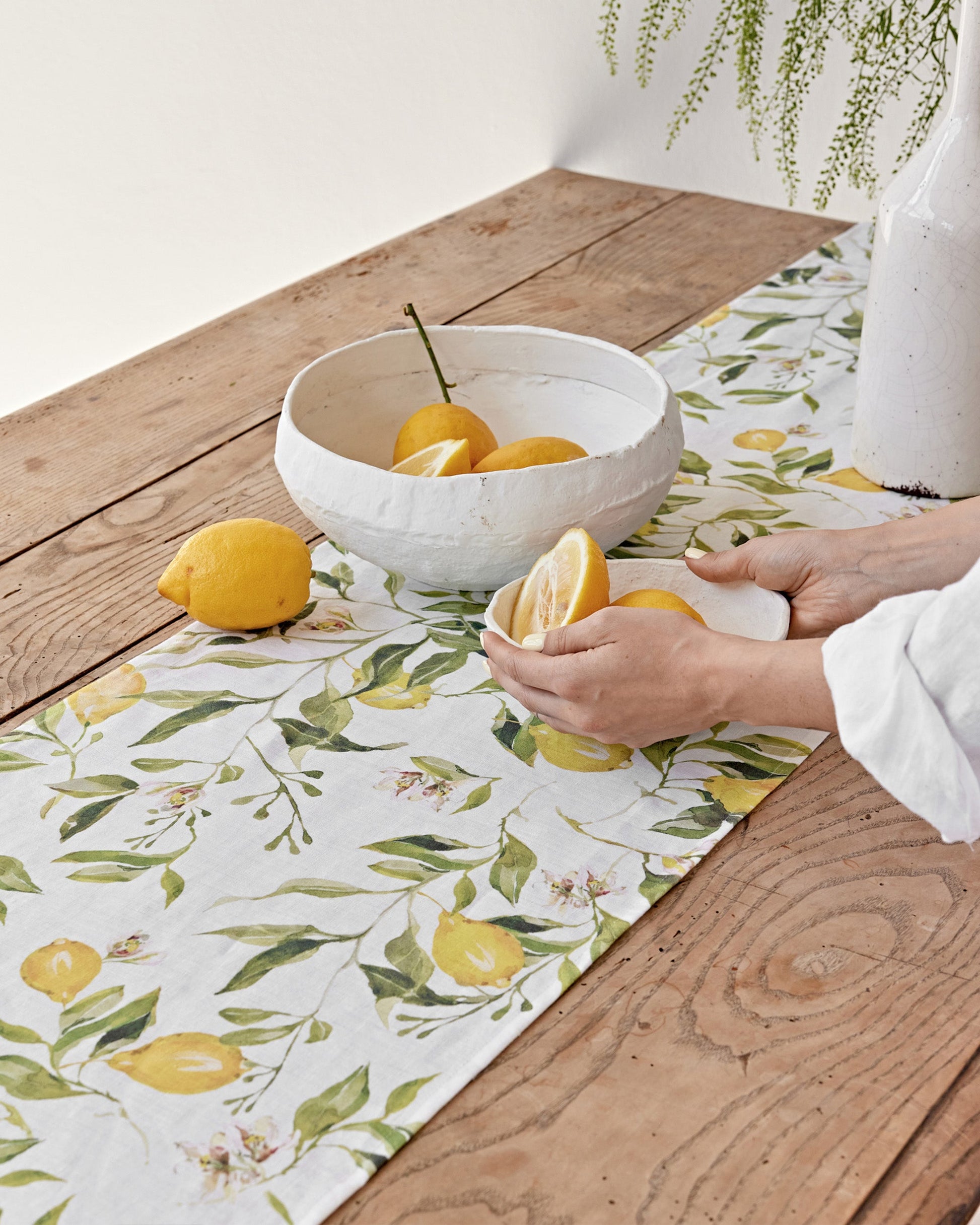 https://cdn.shopify.com/s/files/1/0640/8454/1699/files/linen-table-runner-in-citrus-garden-print-on-white-2.jpg?v=1749545405
