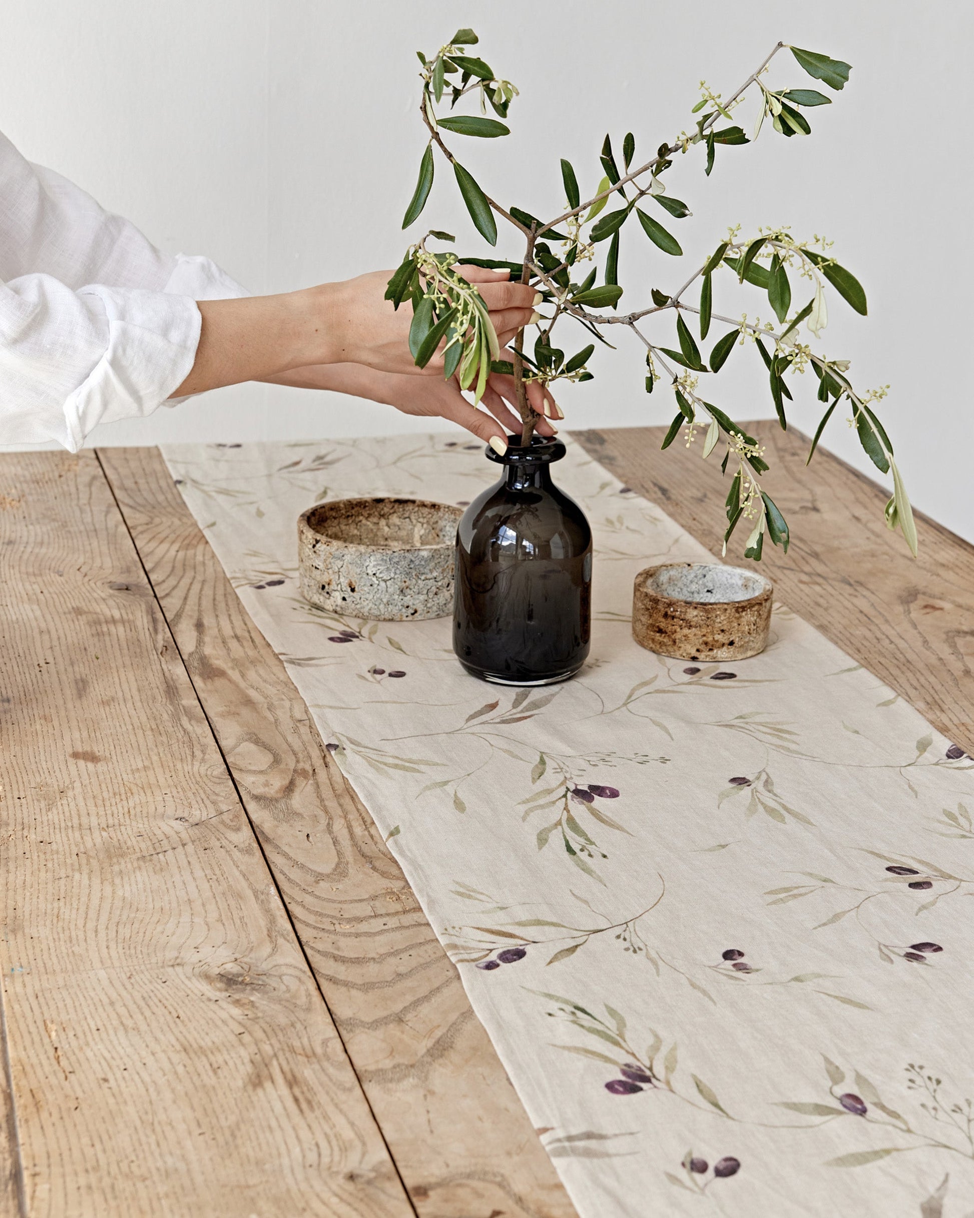 https://cdn.shopify.com/s/files/1/0640/8454/1699/files/linen-table-runner-in-olive-orchard-print-on-natural-1.jpg?v=1749545420