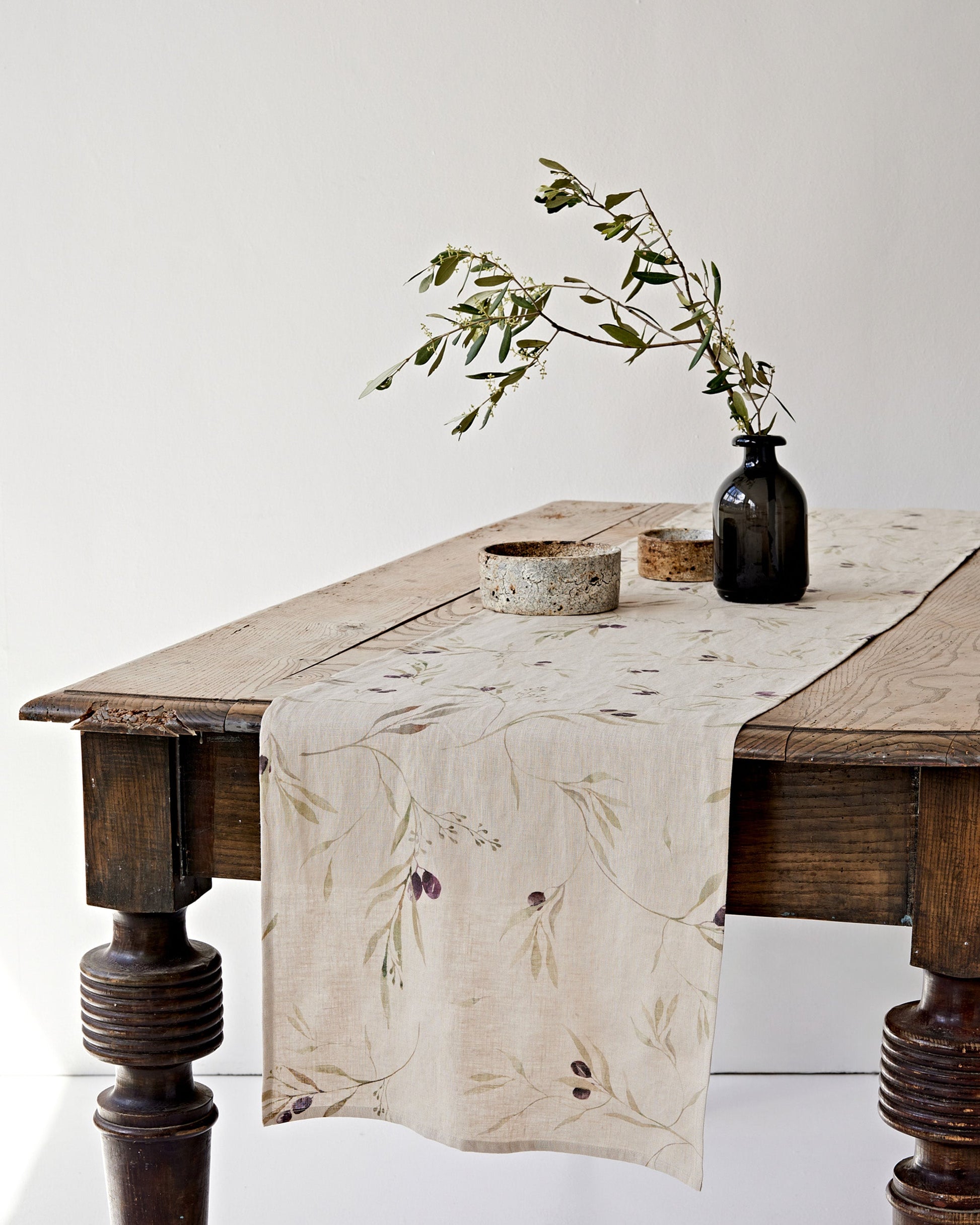 https://cdn.shopify.com/s/files/1/0640/8454/1699/files/linen-table-runner-in-olive-orchard-print-on-natural-2.jpg?v=1749545420