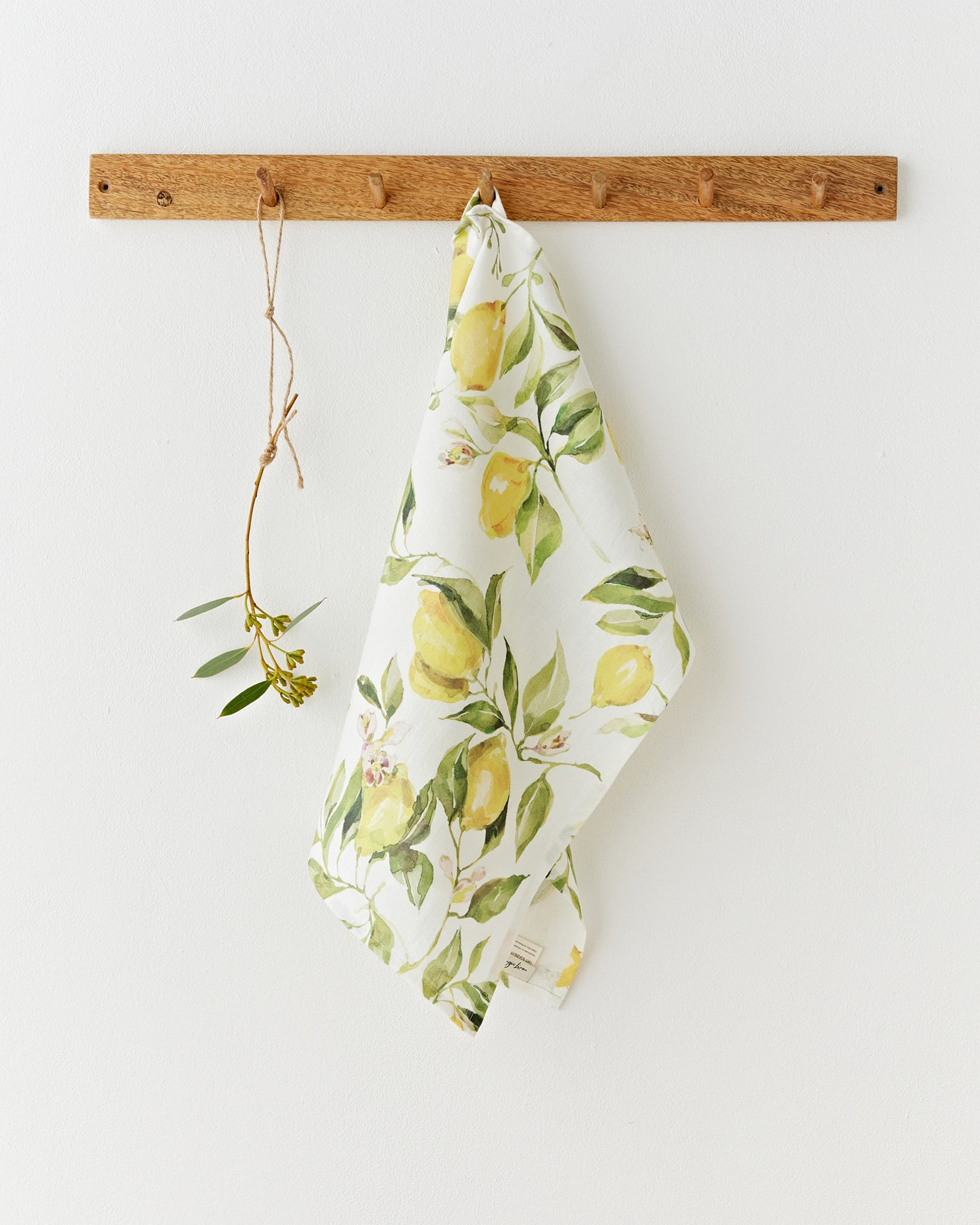 https://cdn.shopify.com/s/files/1/0640/8454/1699/files/linen-tea-towel-in-citrus-garden-print-on-white-2.jpg?v=1749545407