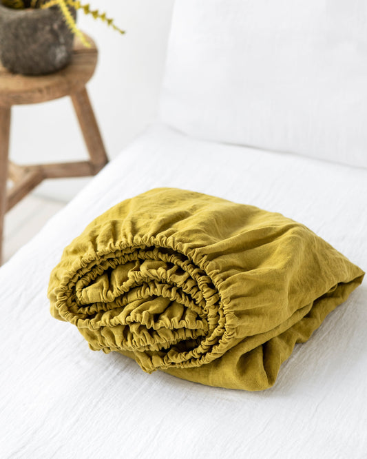 https://cdn.shopify.com/s/files/1/0640/8454/1699/products/moss-yellow-linen-fitted-sheet-1.jpg?v=1754487447