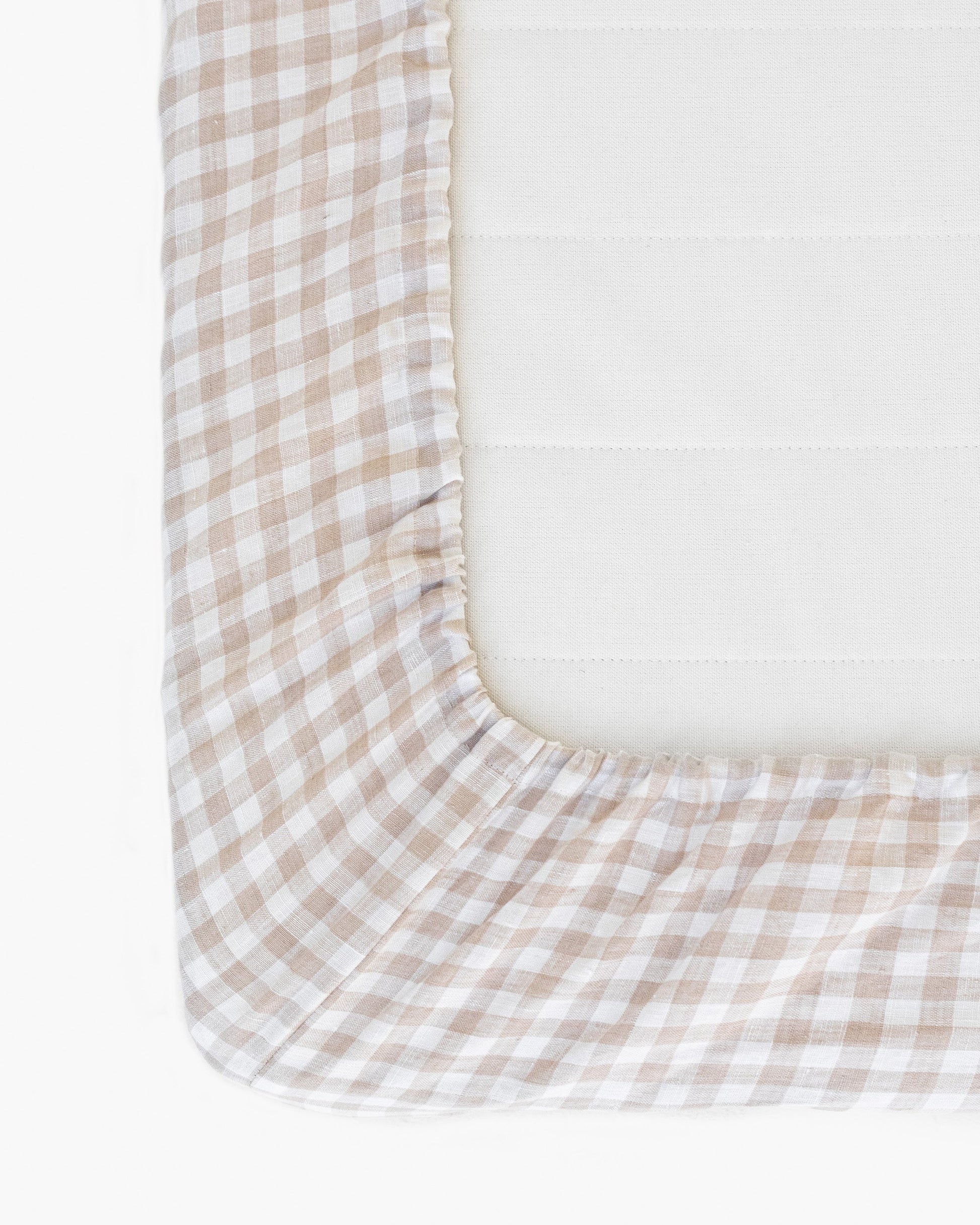 https://cdn.shopify.com/s/files/1/0640/8454/1699/files/natural-gingham-fitted-sheet-2.jpg?v=1697009059