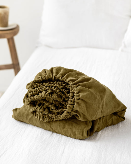 https://cdn.shopify.com/s/files/1/0640/8454/1699/products/olive-green-linen-fitted-sheet-1.jpg?v=1660217881
