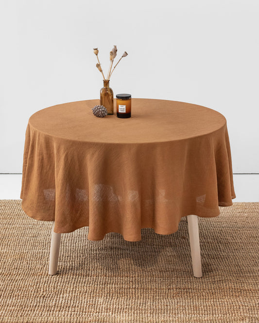 https://cdn.shopify.com/s/files/1/0640/8454/1699/products/round-linen-tablecloth-cinnamon-0.jpg?v=1677681472