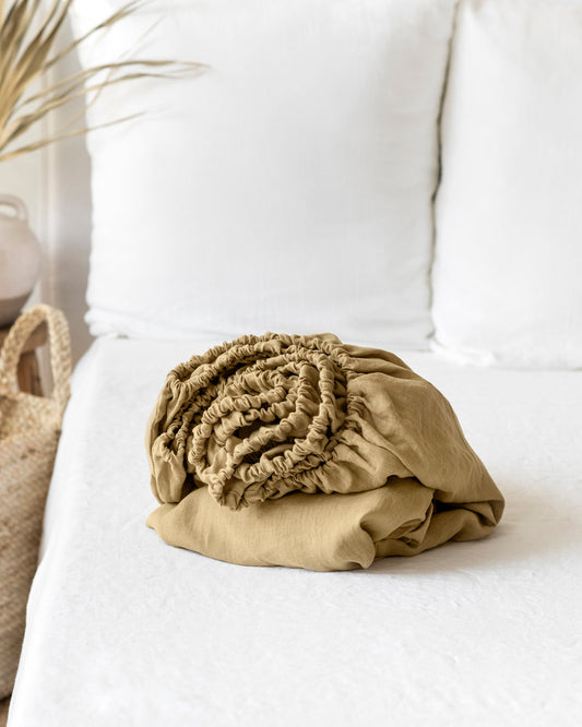https://cdn.shopify.com/s/files/1/0640/8454/1699/products/sandy-beige-linen-fitted-sheet-1.jpg?v=1754487420