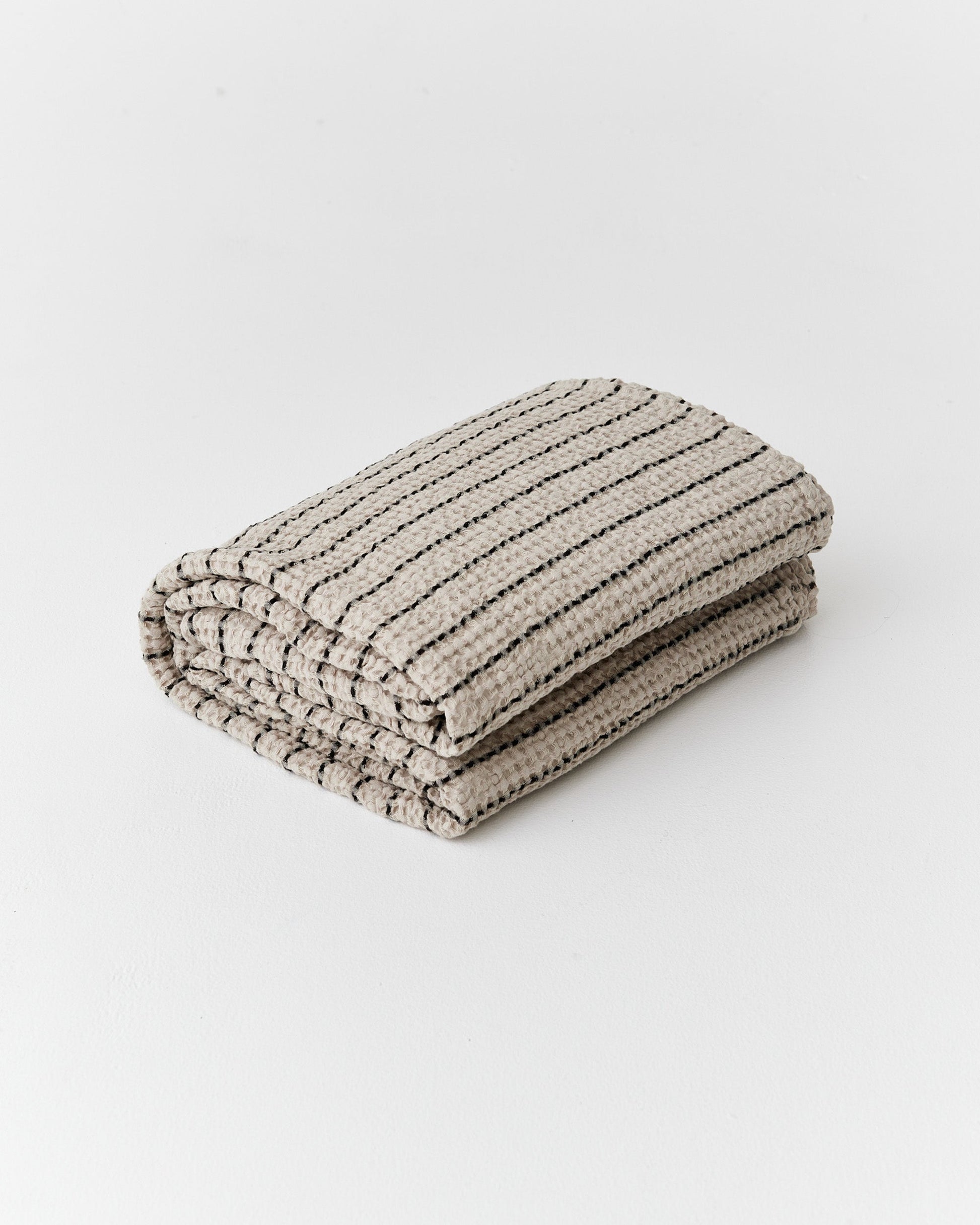 https://cdn.shopify.com/s/files/1/0640/8454/1699/files/striped-waffle-blanket-1.jpg?v=1758111121